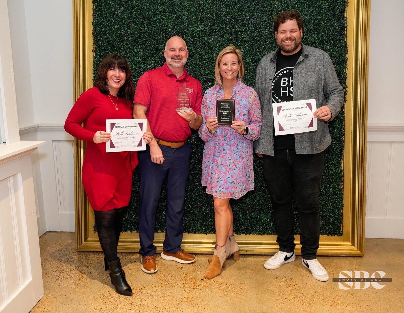 Beth Graham accepting 2025 awards at Berkshire Hathaway HomeServices Ally Real Estate, including 1MM+ Producer, Most Volume Growth, Brand Ambassador, and the Sharon Harmon Award